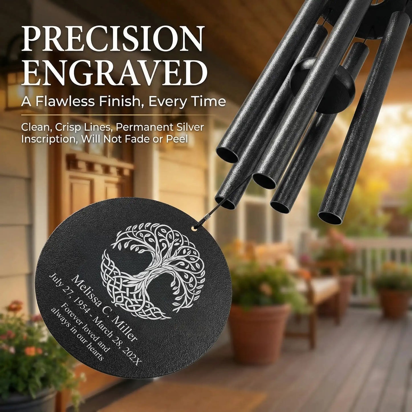 Close up of laser engraved Celtic tree of life memorial wind chime disc with custom name, dates, and personal message
