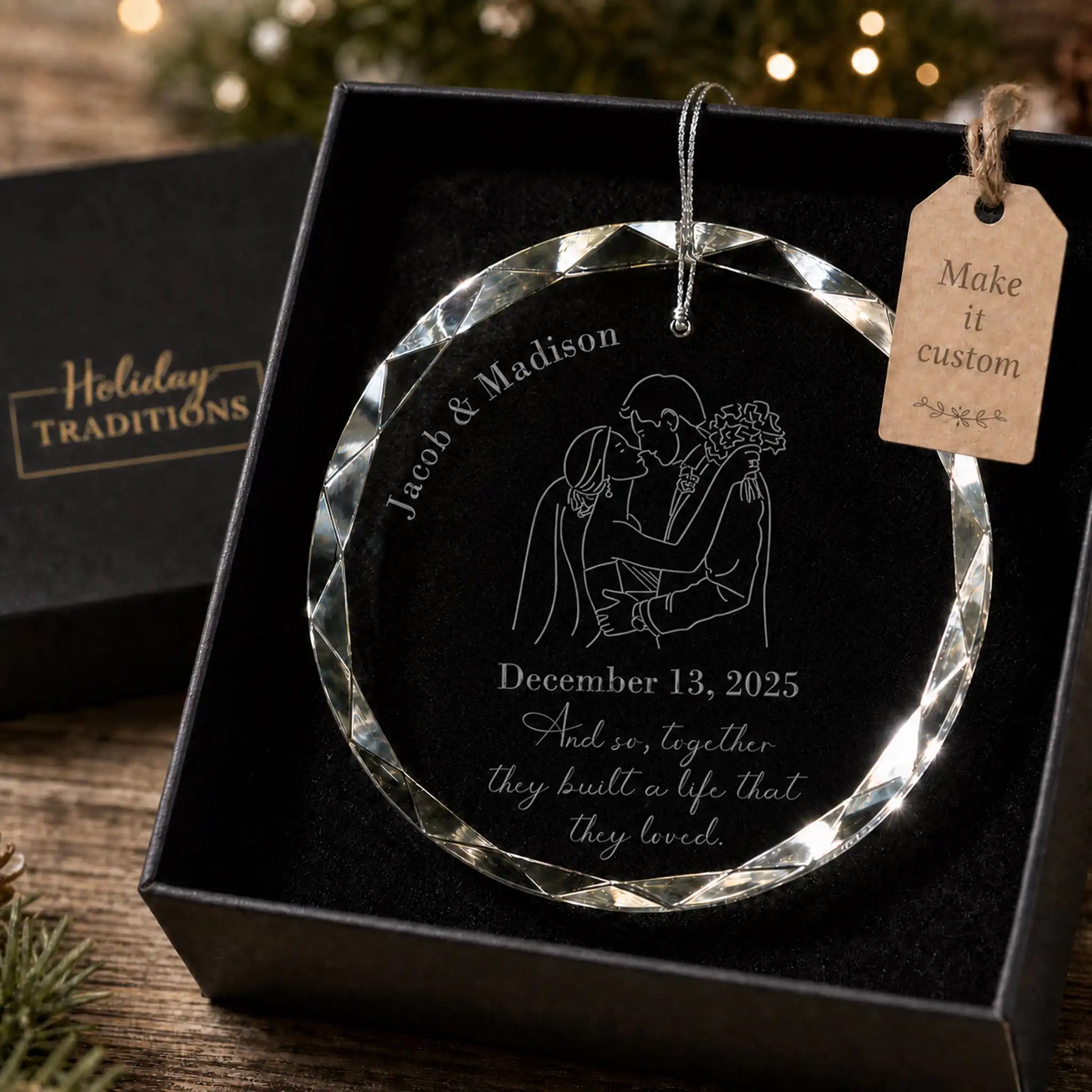 Wedding silhouette personalized glass ornament with a bride and groom illustration, laser engraved with the couple's names, wedding date and the phrase And so, together they built a life that they loved, shown in its black gift box