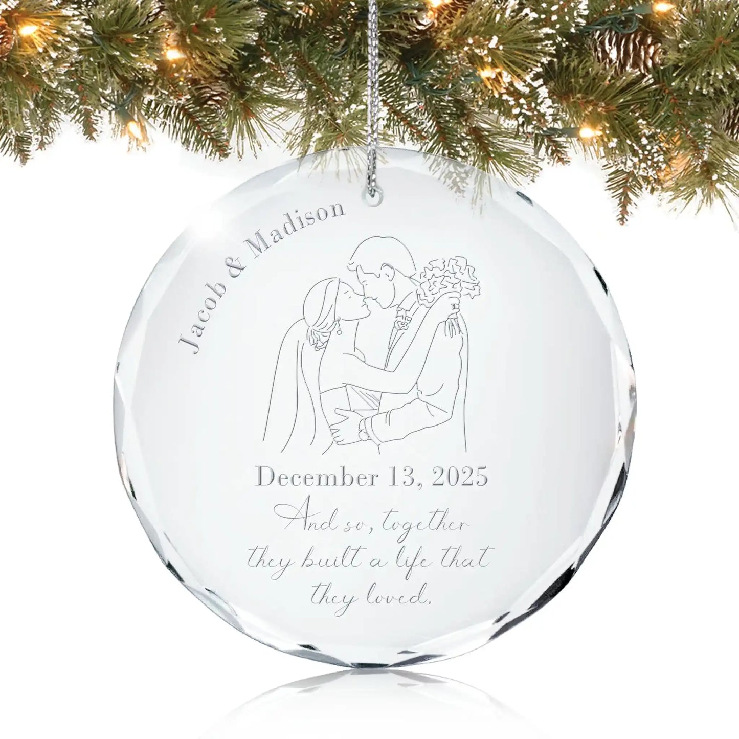 Personalized crystal wedding ornament engraved with Name and Date with a text of "And so, together they built a life that they loved” featuring engraved bride and groom illustration hanging on Christmas tree