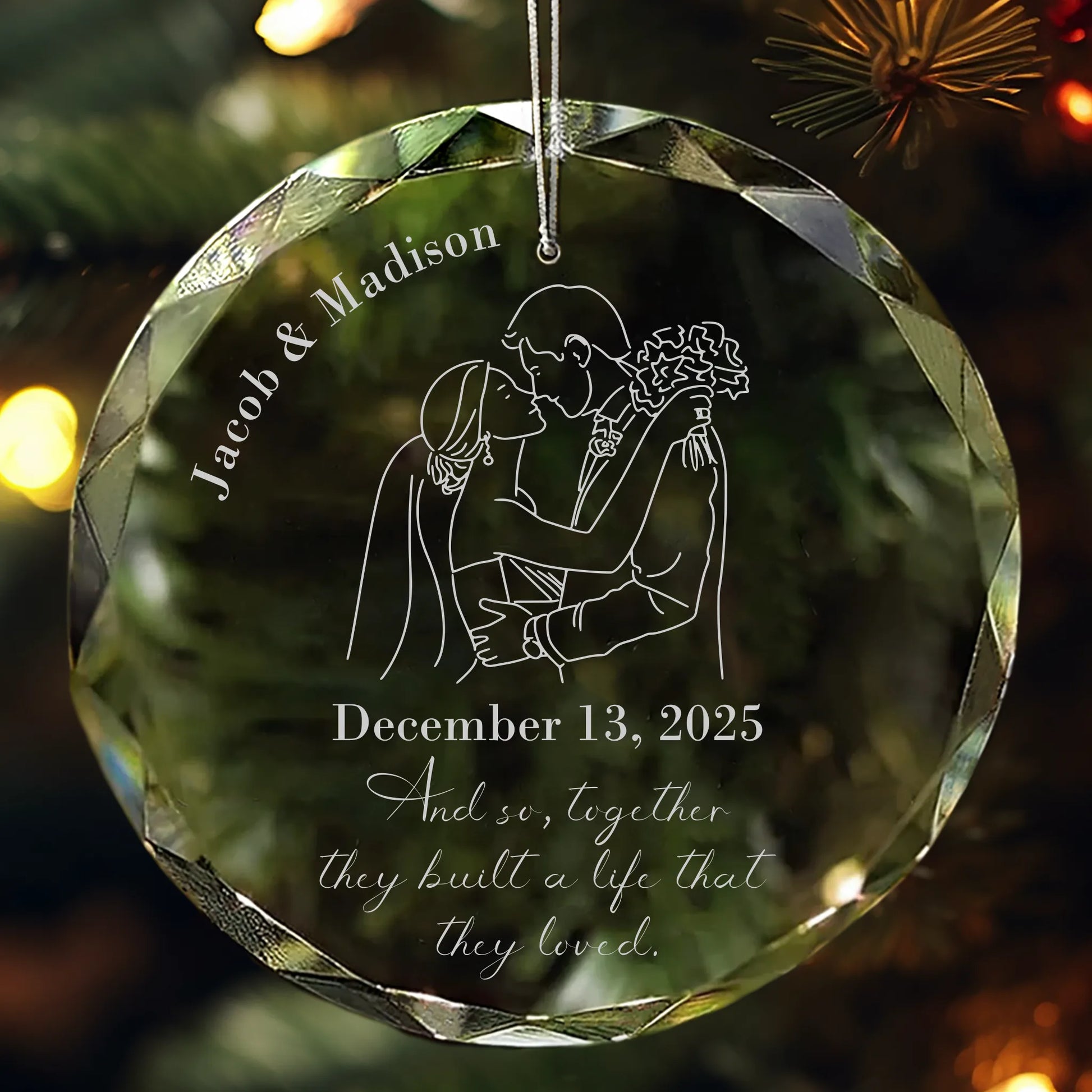 Personalized crystal wedding ornament engraved with Name and Date with a text of "And so, together they built a life that they loved” featuring engraved bride and groom illustration hanging on Christmas tree
