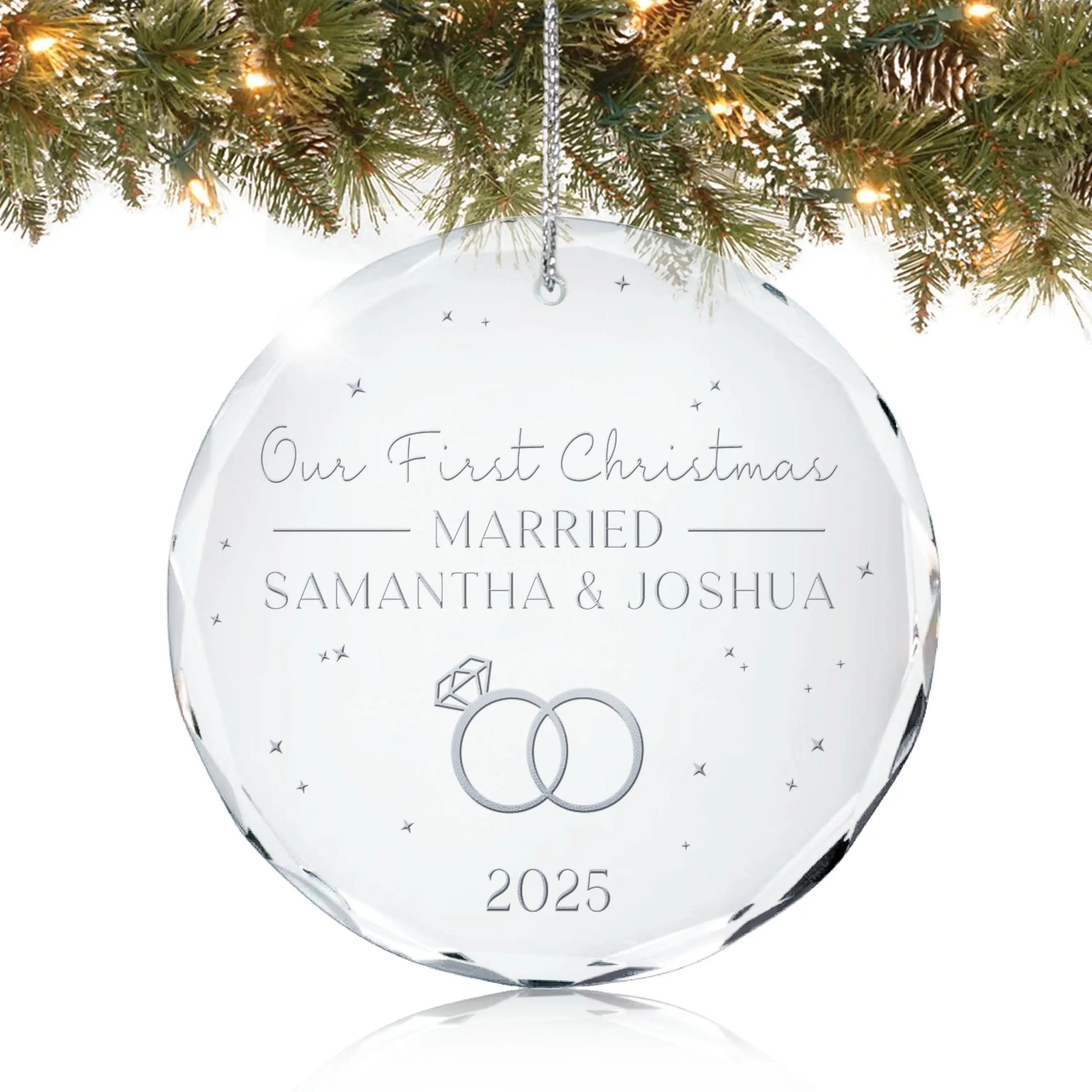 Personalized crystal ornament engraved with “Our First Christmas Married with Name and Year” featuring interlocking rings design hanging on Christmas tree