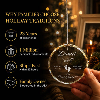 Hand holding the footprints personalized baby's first Christmas glass ornament by the tree, Holiday Traditions is family owned in the USA and ships within 23 hours