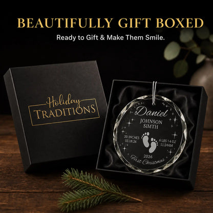 Footprints and stars personalized baby's first Christmas glass ornament arrives in a black Holiday Traditions gift box, ready to give