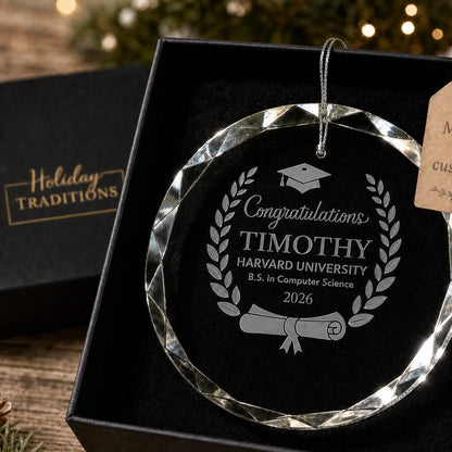Laurel wreath cap and diploma personalized glass ornament, laser engraved with Congratulations, name, school, degree and class year, shown in its black gift box