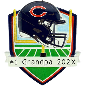 Personalized Chicago Bears Christmas ornament with the Bears helmet over a football field and yellow goal posts, and a laser engraved name banner