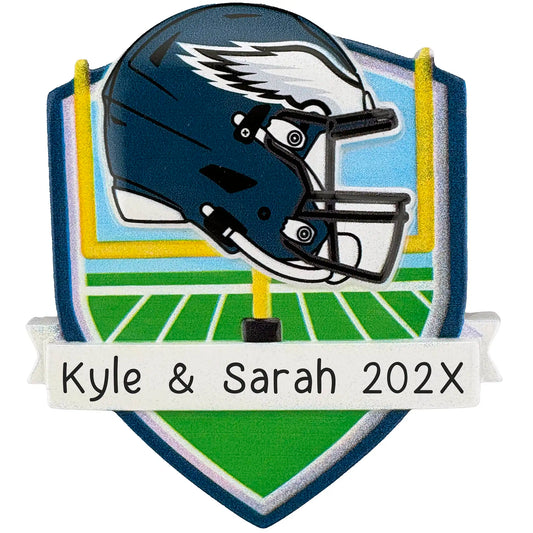 Philadelphia Eagles personalized Christmas ornament with team helmet over goal post and laser-engraved banner