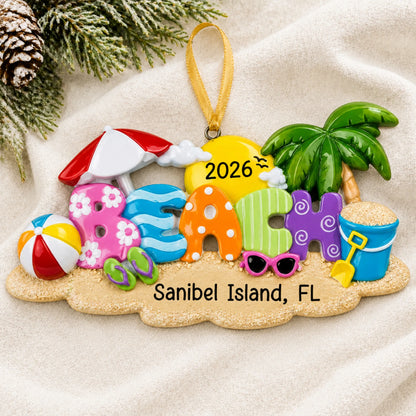 Personalized beach fun christmas ornament laid on a soft white knit blanket
