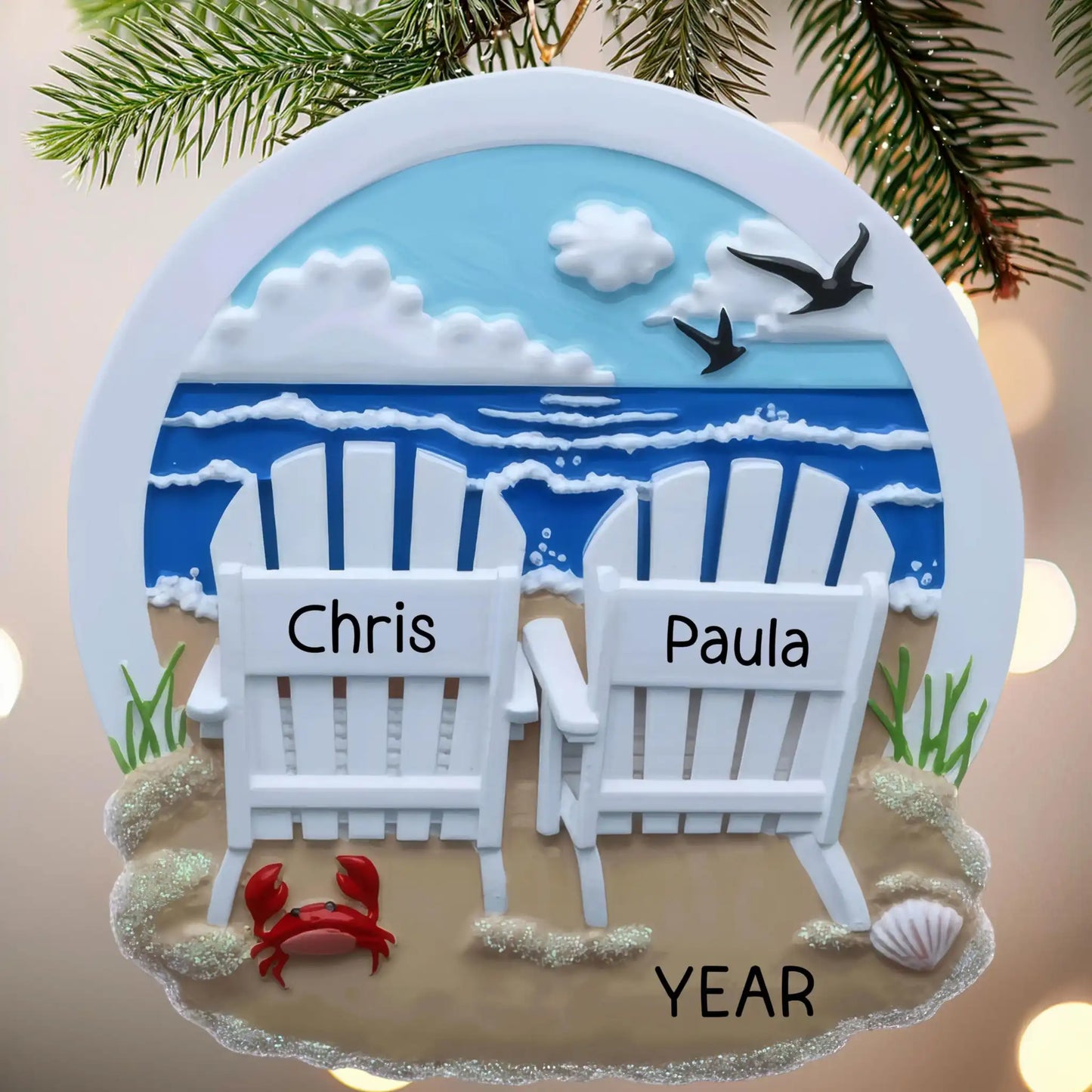 Decorative ornament with two Adirondack chairs, a crab, and the names 'Chris' and 'Paula'.