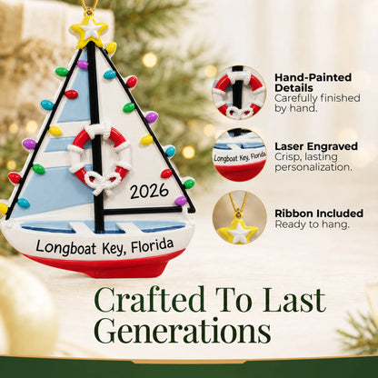 Hand-painted details and laser engraved personalization on the lighted sailboat christmas ornament, ribbon included
