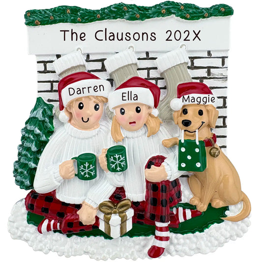 Couple with dog Christmas ornament personalized with names and year, featuring festive pajamas and mugs