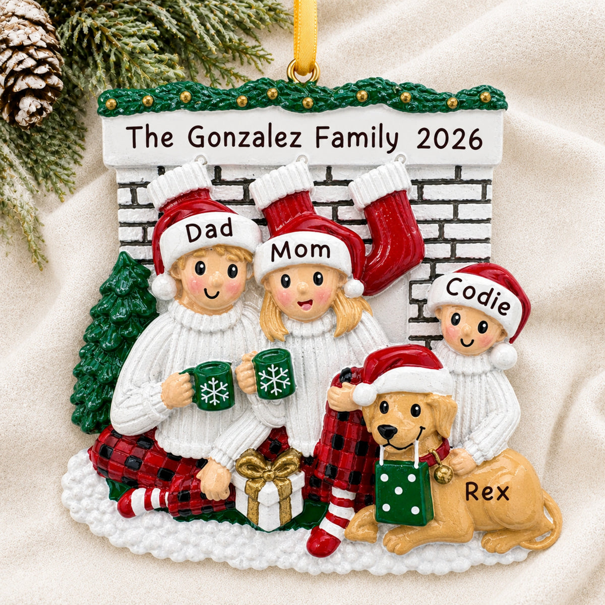 Personalized family of 3 with dog fireplace Christmas ornament hanging on a tree branch with names and 2026