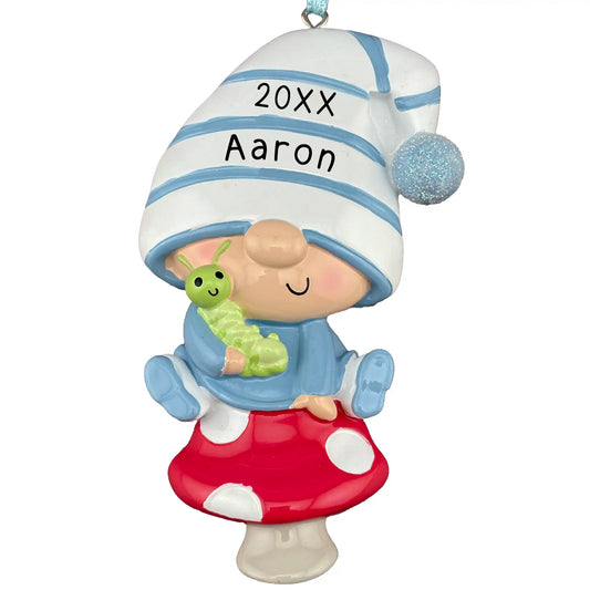 Personalized baby boy gnome ornament with blue striped hat, red mushroom seat, and engraved name and year