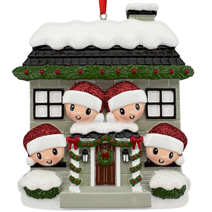 New home family of 4 personalized ornament shown blank, snowy stone house with four Santa hat faces before laser engraving