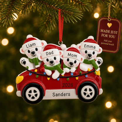 Personalized polar bears family of 4 Christmas ornament in a red car hanging on a tree with a Made Just For You tag