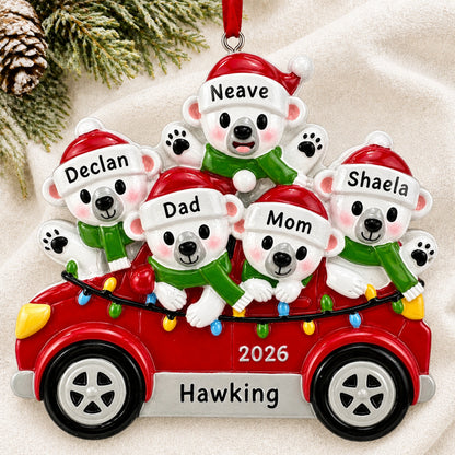 Personalized polar bears family of 5 Christmas ornament hanging on a tree branch with names and 2026
