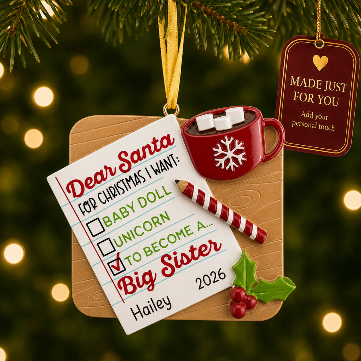 Personalized big sister Christmas ornament on tree with a Made Just For You gift tag