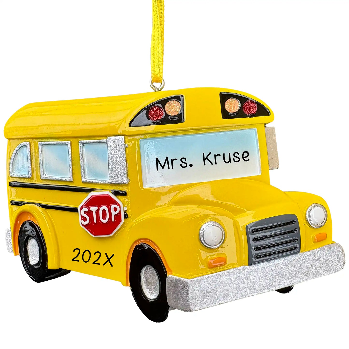 A personalized yellow school bus ornament with a bus driver's name and the year.