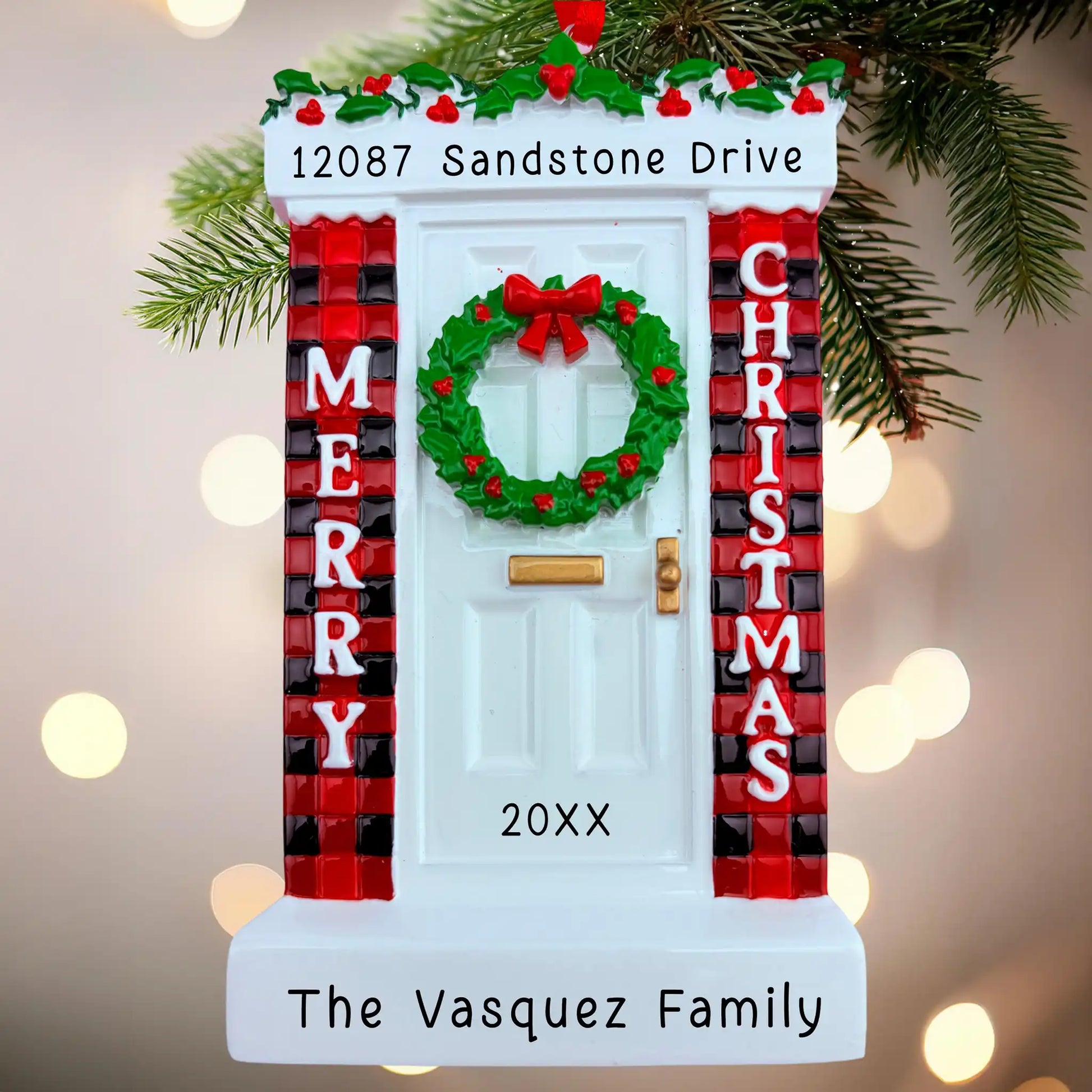 Christmas door ornament with wreath, plaid decorations, and personalized text on a blurred light background.