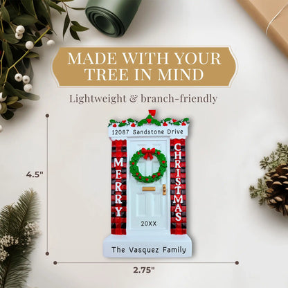 Christmas-themed door ornament with wreath, plaid decorations, and white door. Measurement shows 4.50 by 2.75 inches.