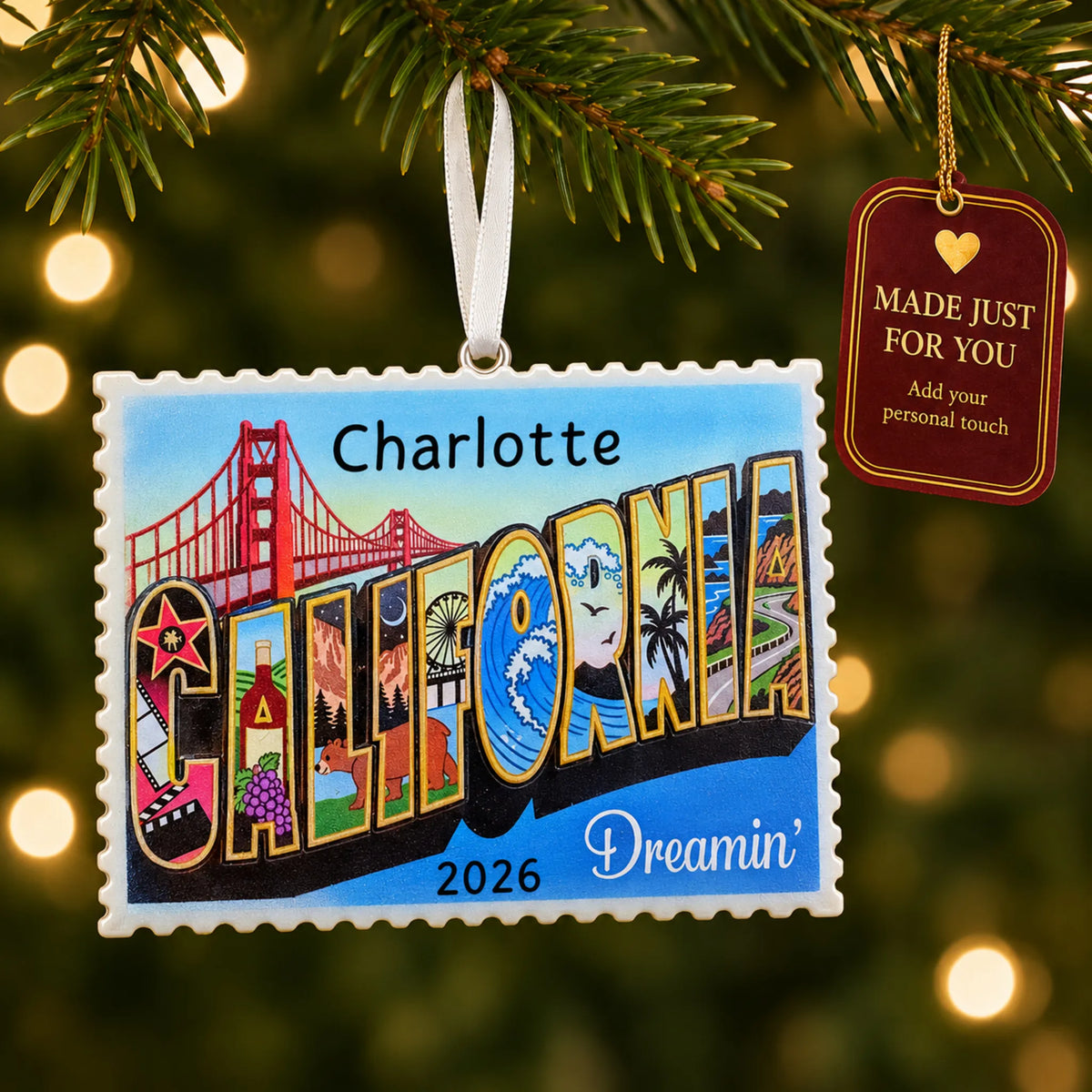 California postcard christmas ornament hanging on a lit Christmas tree with a Made Just For You gift tag