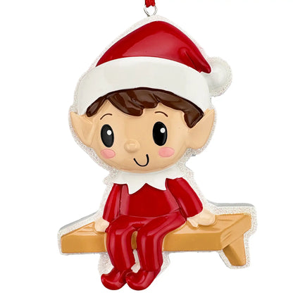 Christmas elf personalized ornament shown blank, red suited elf on a wooden bench before laser engraving