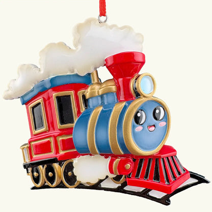 Kids train personalized Christmas ornament shown blank before laser engraving, red and green polyresin engine with a friendly face