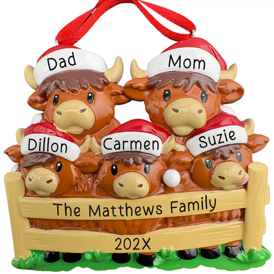 Personalized Highland Cow family of 5 Christmas ornament, two cows and three calves in Santa hats behind a fence, names engraved on hat brims with family name and year on the rails
