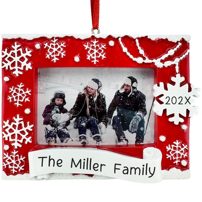 Red snowflake Christmas photo frame ornament personalized with name or year, holds a family picture