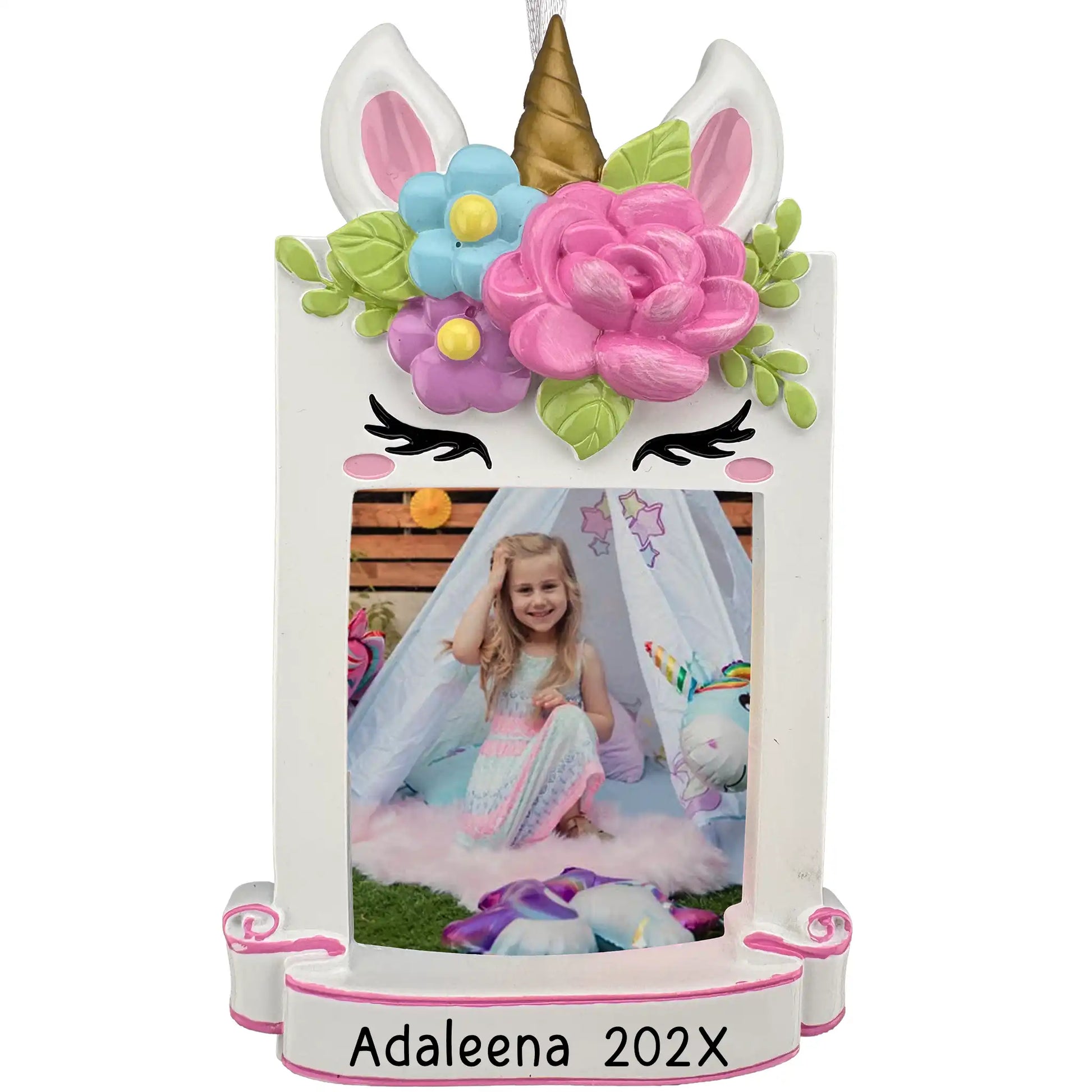 Personalized unicorn photo frame ornament with gold horn and floral crown, holding a girl's photo above a laser engraved banner with name and year