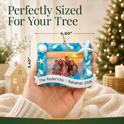 Size guide: the personalized beach vacation photo frame christmas ornament is 4.60 in wide by 3.40 in tall, shown in hand