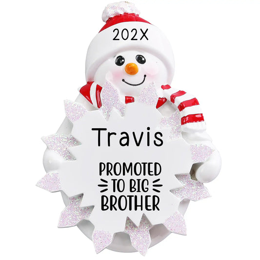 Personalized Christmas ornament featuring a snowman holding a snowflake engraved with "Promoted to Big Brother," ready for a child's name and year customization.