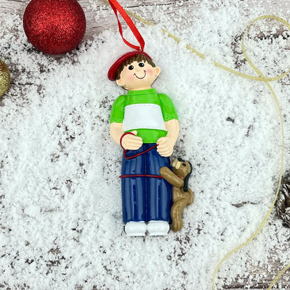 Adorno navideño de niño con perro 