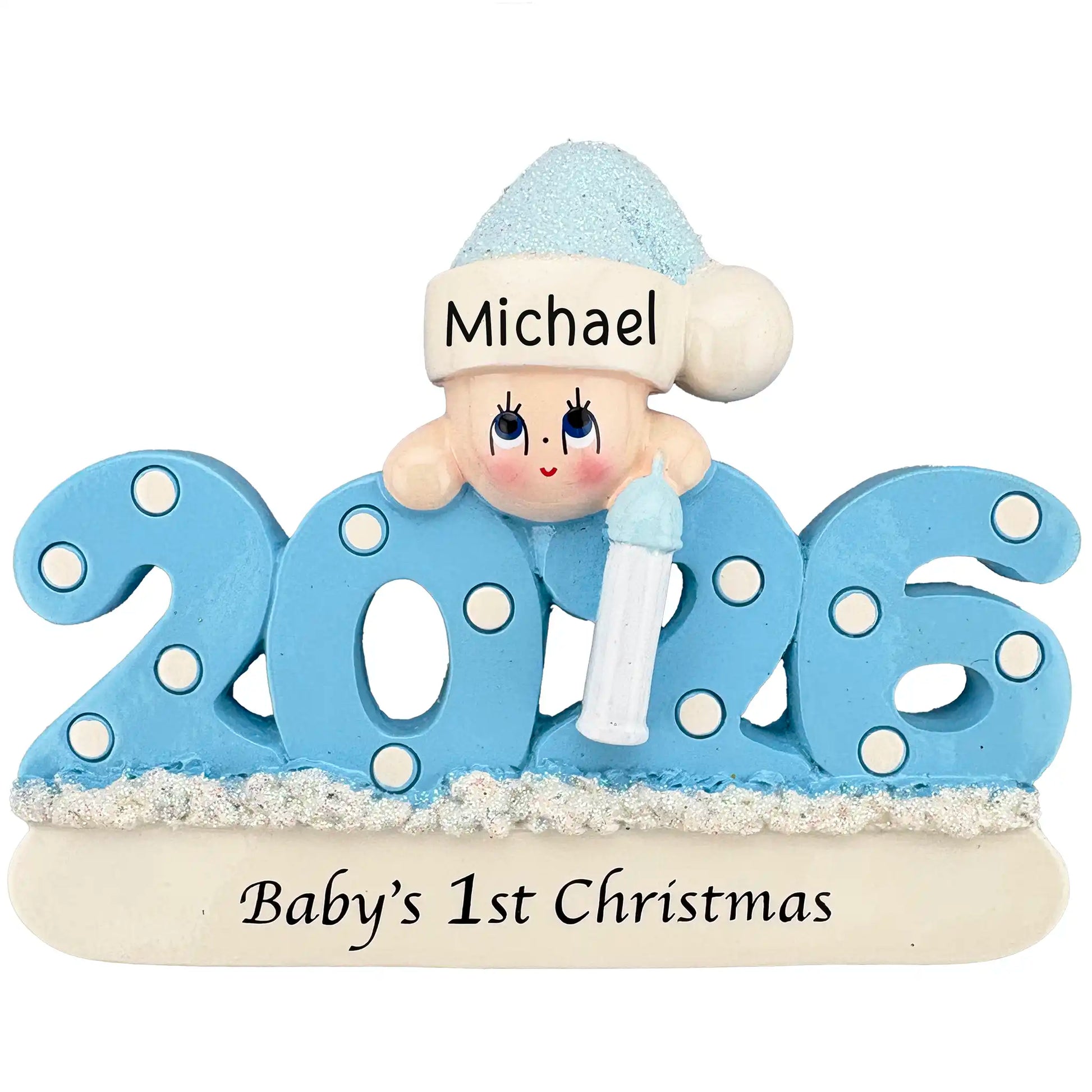 A blue 2026 Baby’s 1st Christmas ornament featuring a smiling baby in a glittery hat holding a bottle.