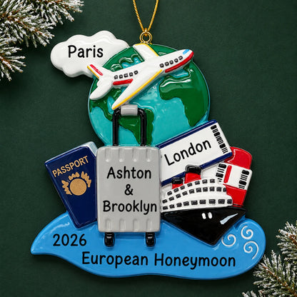 Personalized world traveler passport christmas ornament on a dark green pine background