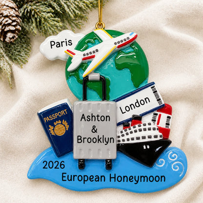 Personalized world traveler passport christmas ornament laid on a soft white knit blanket