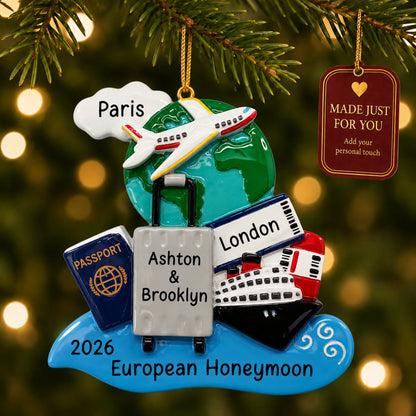 World traveler passport christmas ornament hanging on a lit Christmas tree with a Made Just For You gift tag