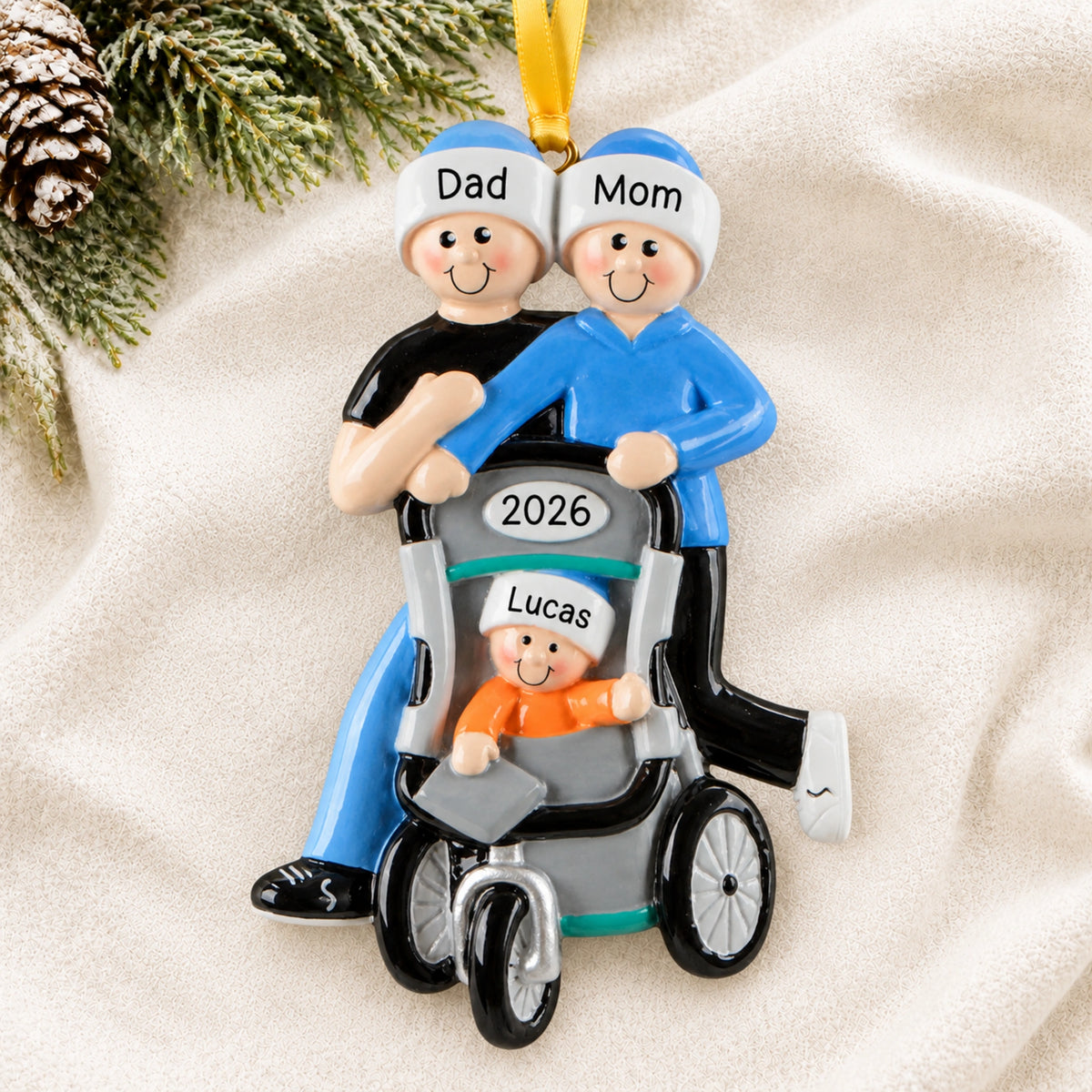 Personalized jogging couple baby stroller Christmas ornament hanging on a tree branch with names and 2026