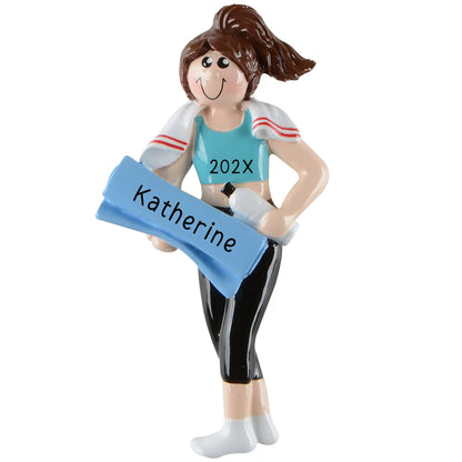 Figurine of a woman in athletic wear holding a blue sign with 'Katherine' and '202X' on a white background