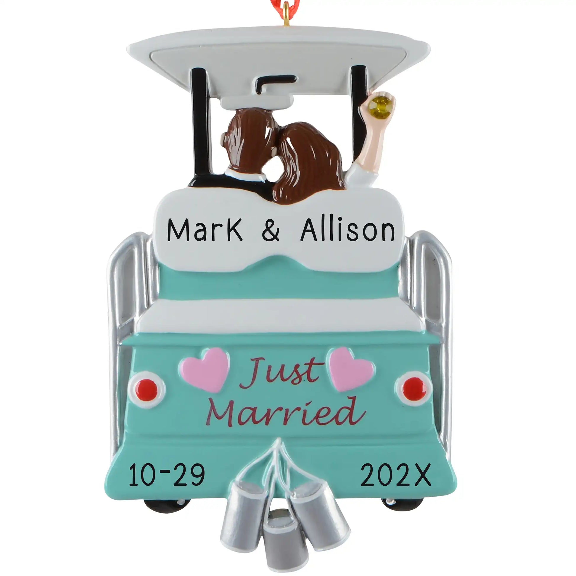 Personalized just married Christmas ornament, a teal getaway cart with tin cans and pink hearts, a kissing bride and groom, engraved Mark & Allison with the wedding date and year