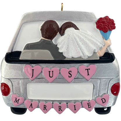 Personalized just married car Christmas ornament with bride and groom, pink heart JUST MARRIED lettering, and blank license plate for custom name and year