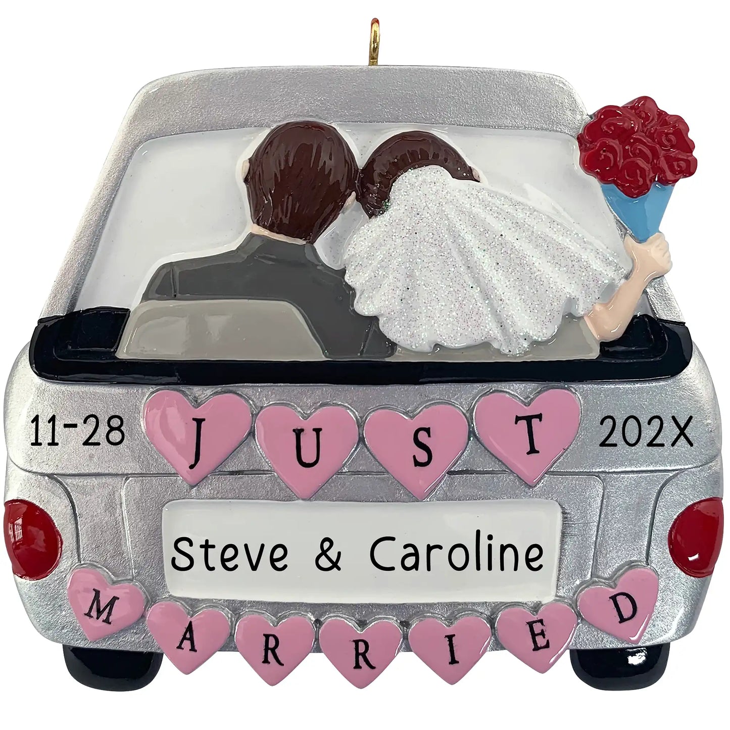 A personalized Christmas ornament of a silver getaway car with pink hearts and a bride and groom inside, featuring space for a custom name on the license plate.