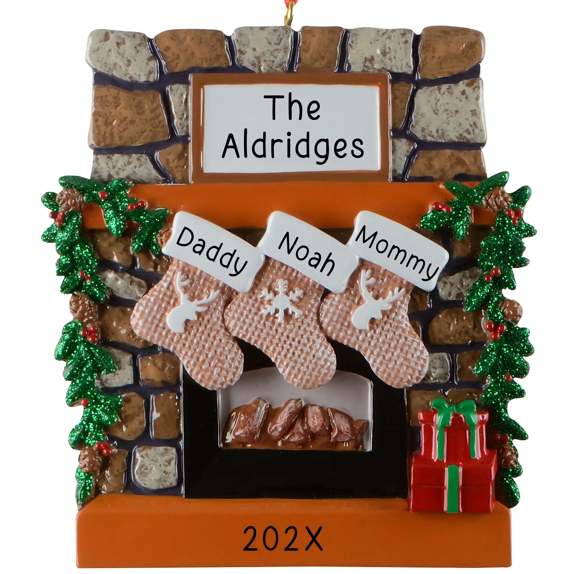 Personalized family of 3 Christmas ornament, a rustic stone fireplace with three named stockings, garland, and a lit hearth, engraved The Aldridges with the year