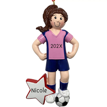 Personalized girl soccer player ornament in pink and blue uniform with soccer ball at feet and red star with custom name and year engraved
