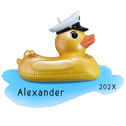 Personalized rubber duck ornament wearing sailor hat floating on blue water, custom name Alexander and year 202X, beach pool themed Christmas keepsake