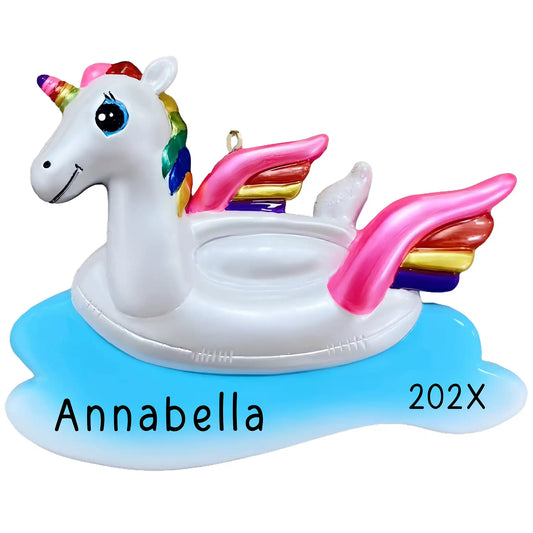 Personalized unicorn float ornament with rainbow mane and pink wings, floating on blue water, custom name Annabella and year 202X, beach vacation Christmas keepsake