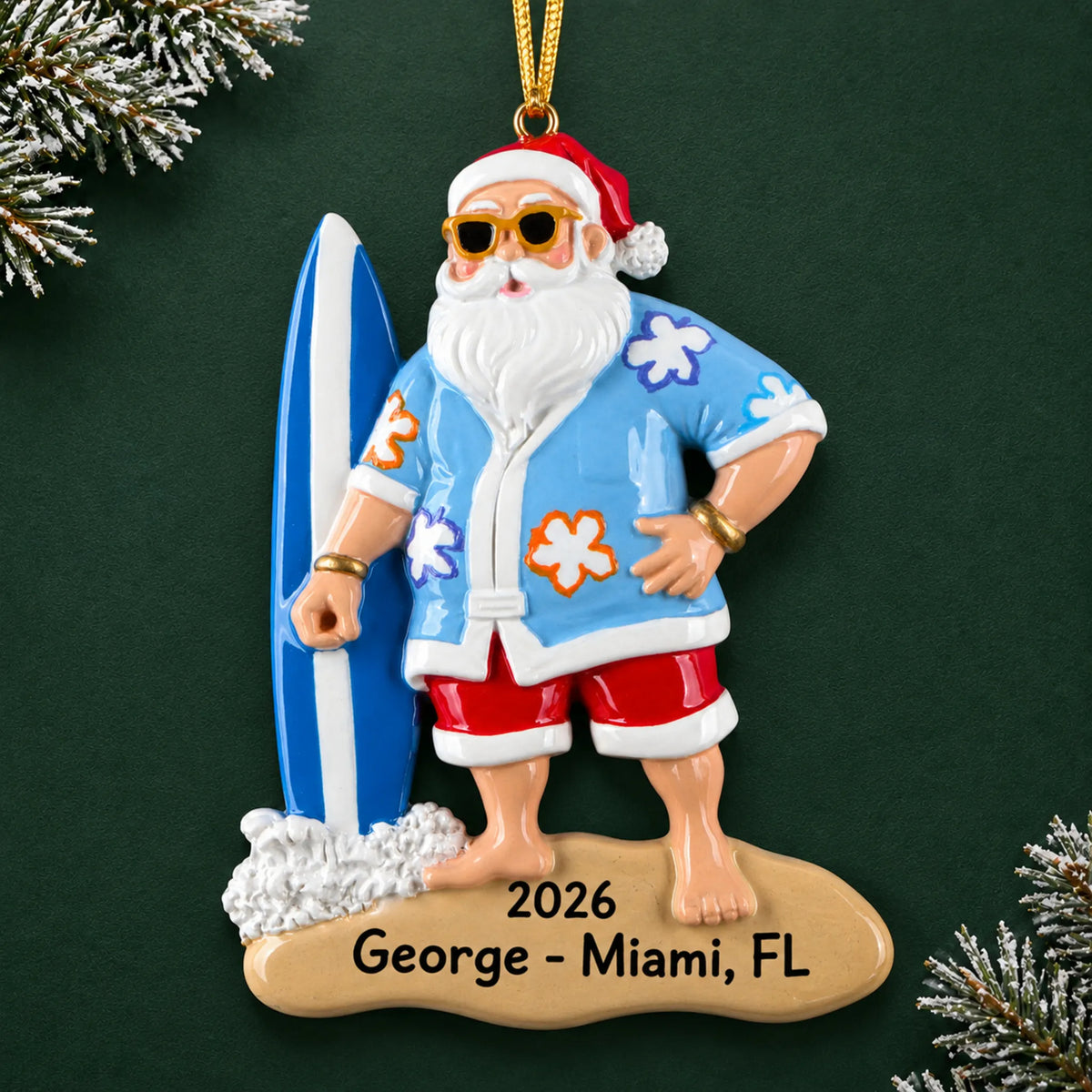 Personalized surfing Santa christmas ornament on a dark green pine background