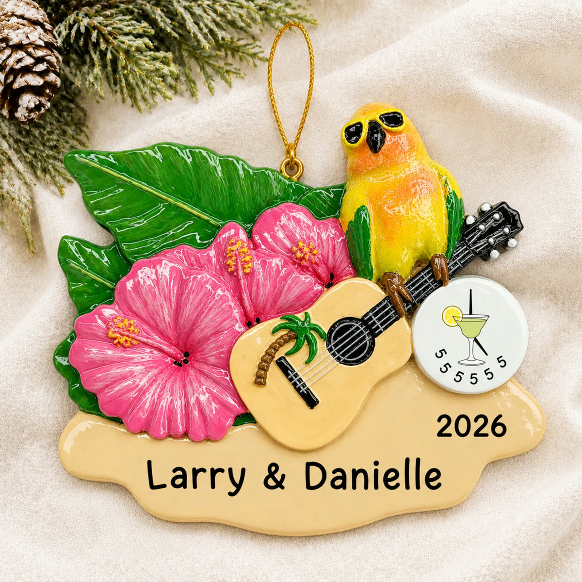 Personalized 5 O'Clock Somewhere parrot christmas ornament laid on a soft white knit blanket