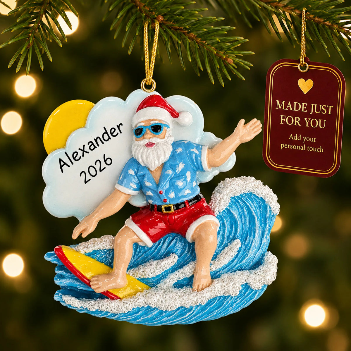Big wave surfing Santa christmas ornament hanging on a lit Christmas tree with a Made Just For You gift tag