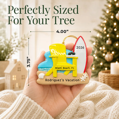 Size guide: the personalized Adirondack chair and surfboard christmas ornament is 4.00 in wide by 3.75 in tall, shown in hand