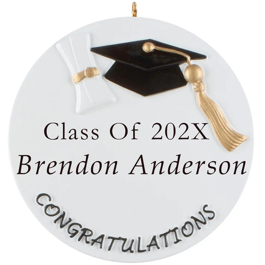 Graduation ornament with black cap, golden tassel, diploma, and space to personalize with name and year